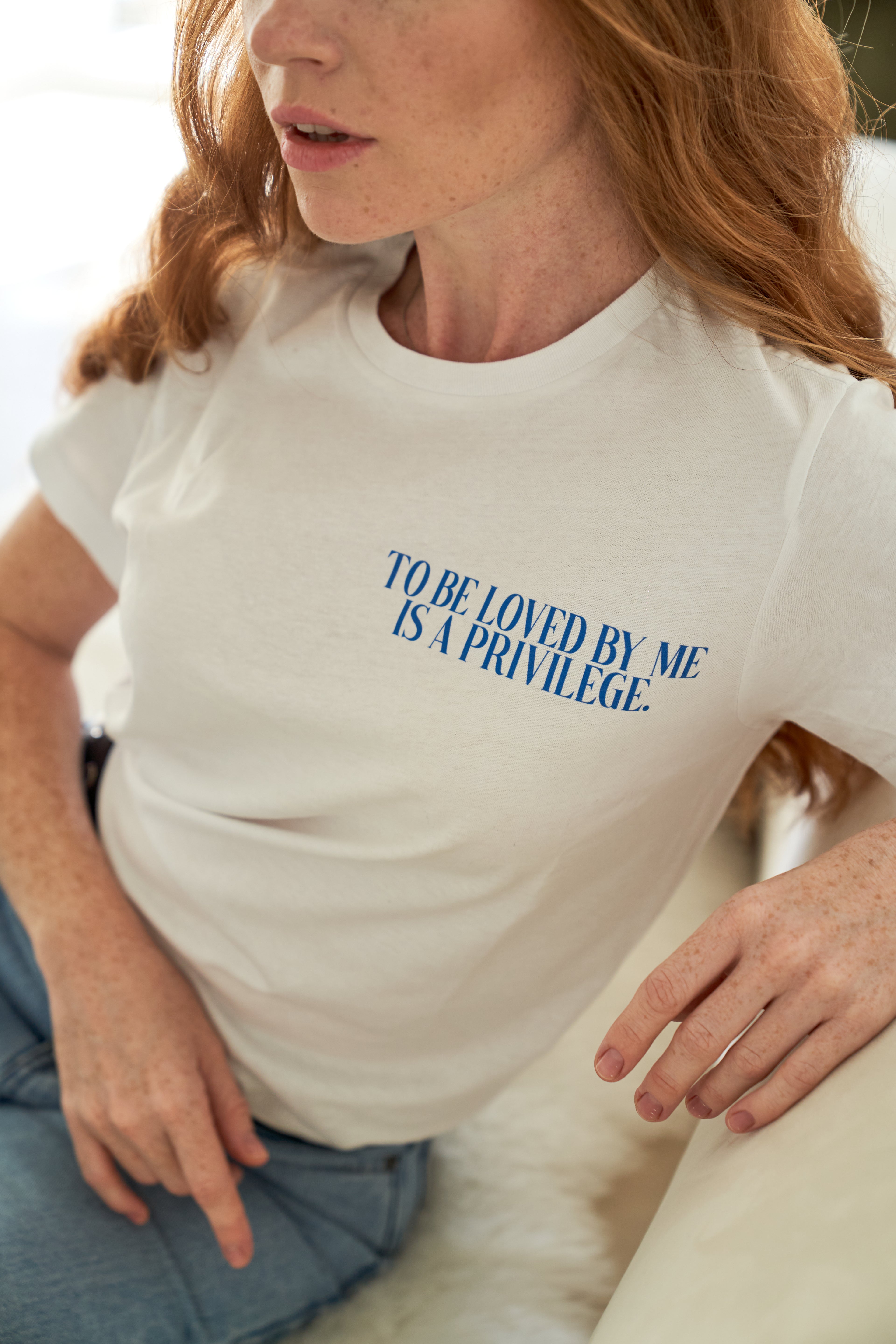 “To be loved by me is a privilege” T-shirt in White
