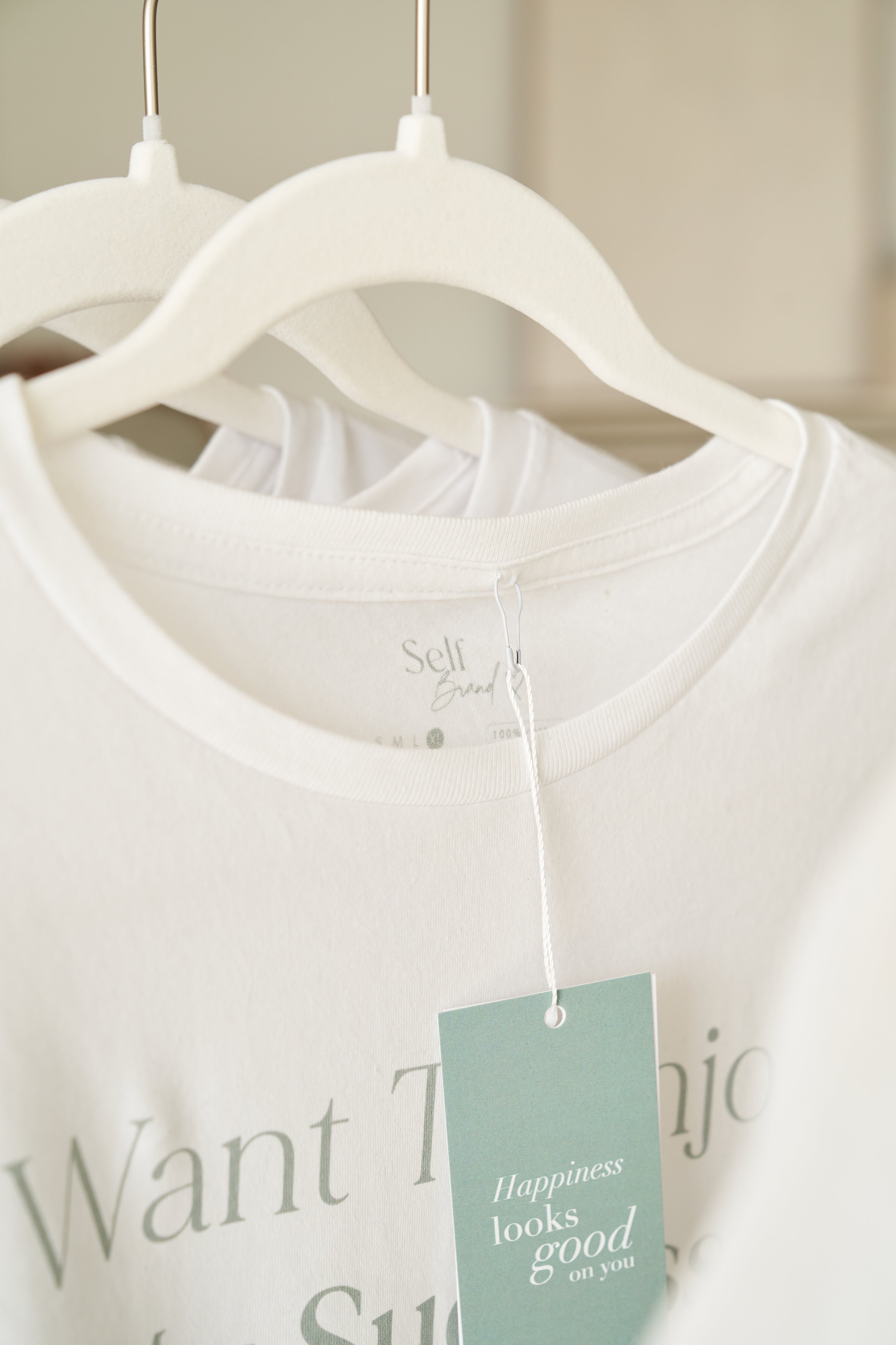 “I want to enjoy my success, not apologize for it” T-shirt in White