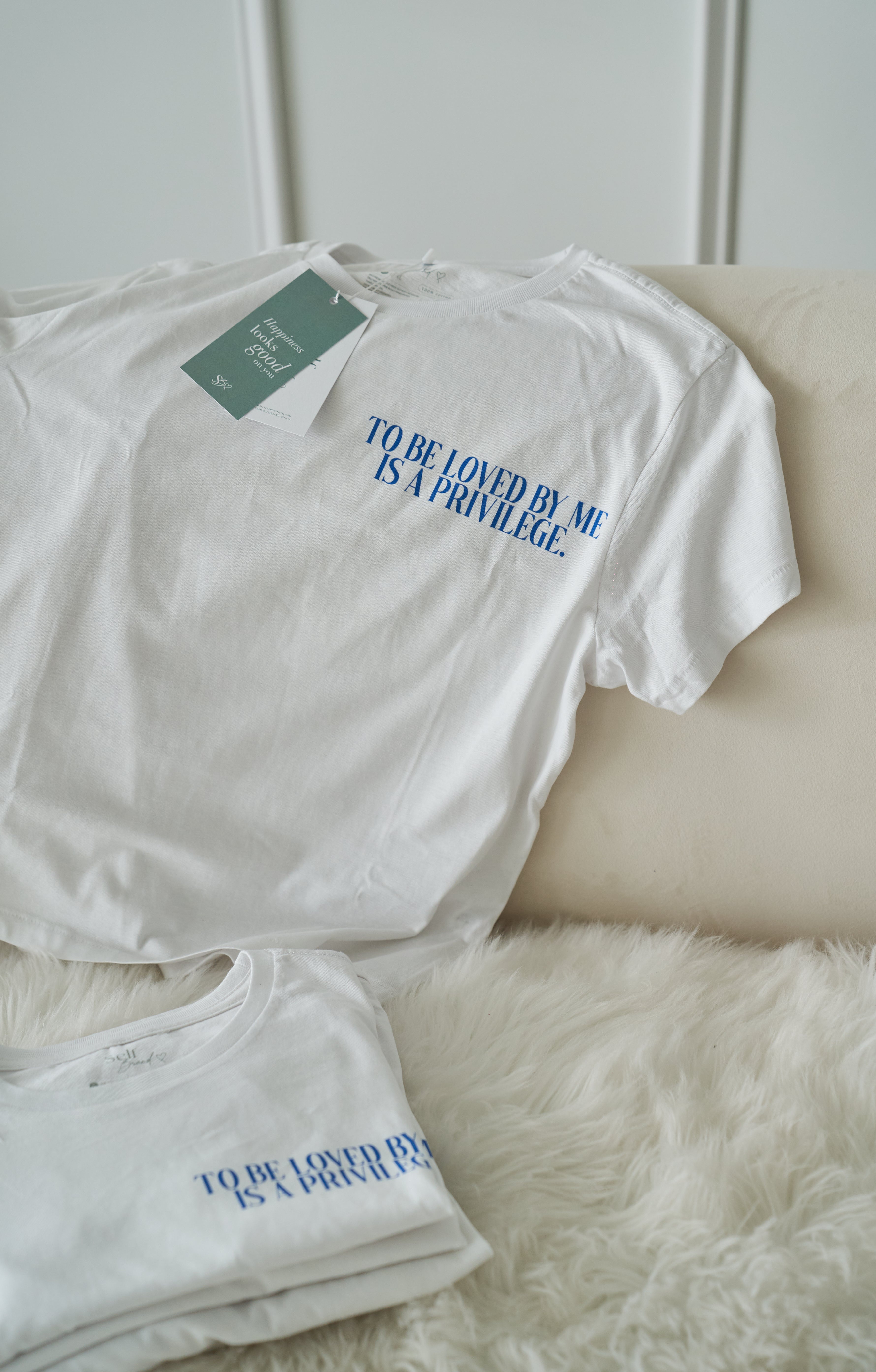 “To be loved by me is a privilege” T-shirt in White