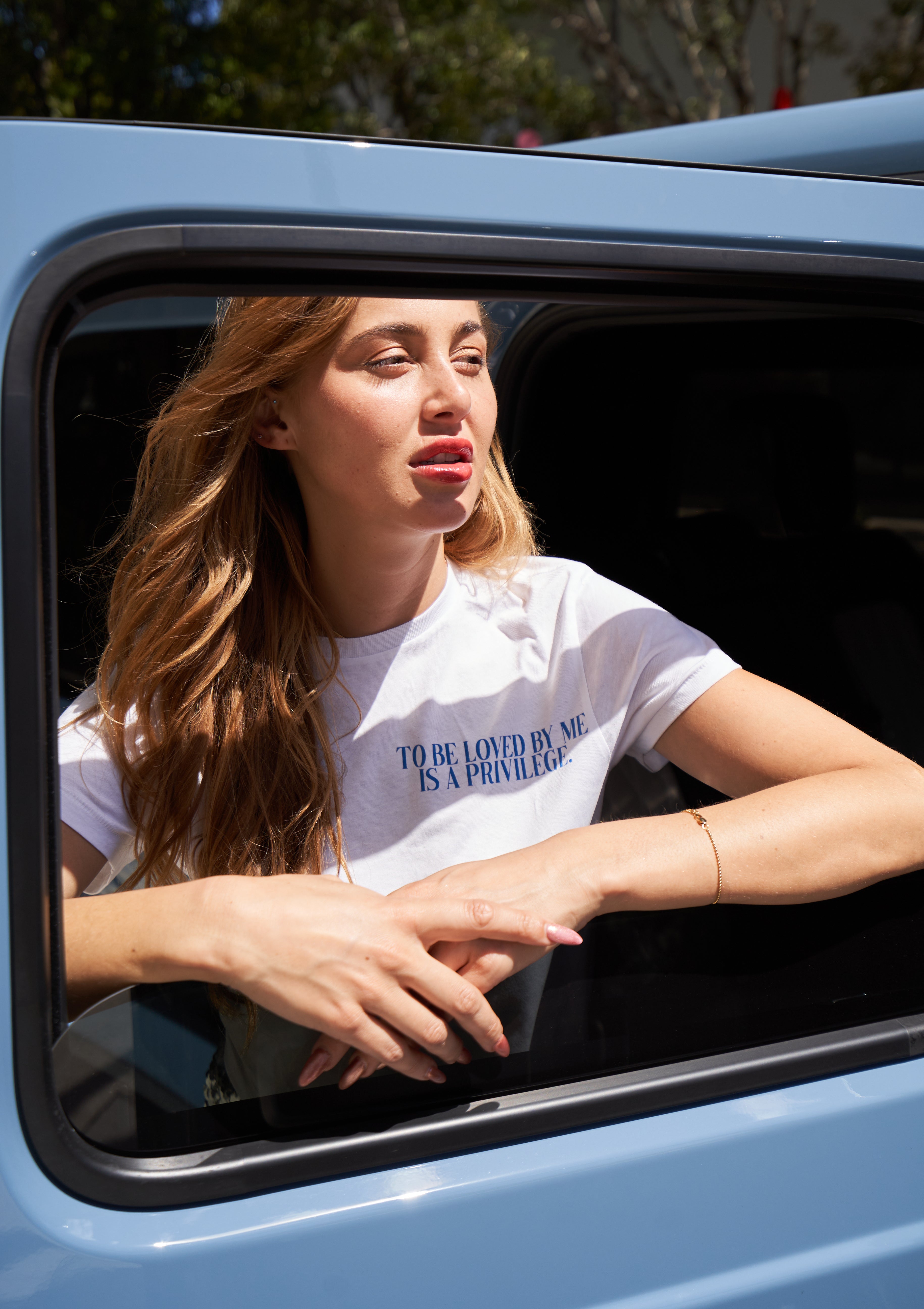 “To be loved by me is a privilege” T-shirt in White