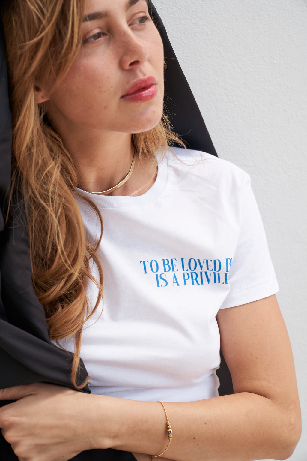 “To be loved by me is a privilege” T-shirt in White